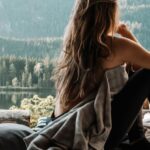 Van Life - Woman in the Back of a Van Looking at Mountains