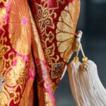 3D Printed Clothing - White Tassels Hanging on a Long Sleeve Clothing