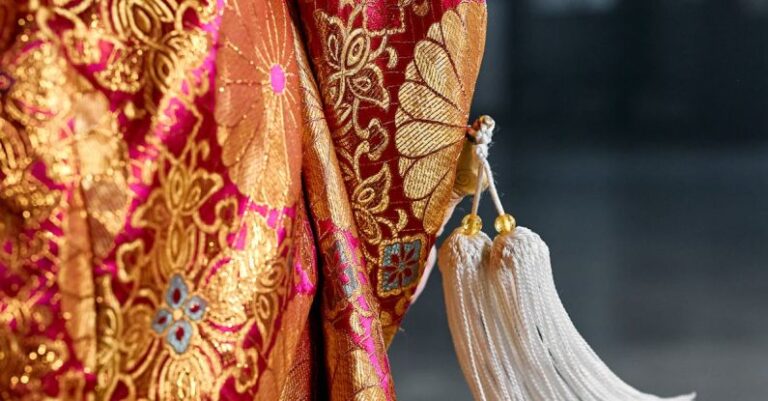 3D Printed Clothing - White Tassels Hanging on a Long Sleeve Clothing