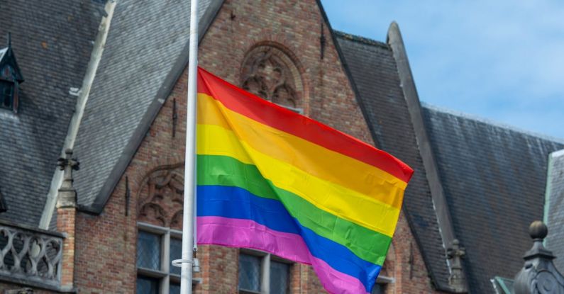Social Movements - Pride Flag of LGBT and Its Social Movements in Front of an old Building