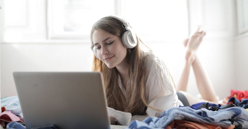 Music Streaming Services - Woman in White Shirt Using Silver Macbook