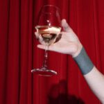 Broadway Shows - Person on Stage Holding a Glass of Wine