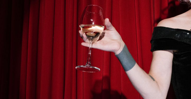 Broadway Shows - Person on Stage Holding a Glass of Wine