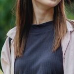 Smart Gardens - Happy Asian female student waling in park