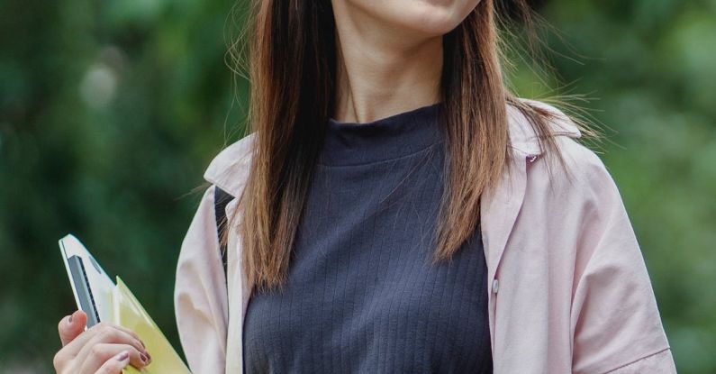 Smart Gardens - Happy Asian female student waling in park