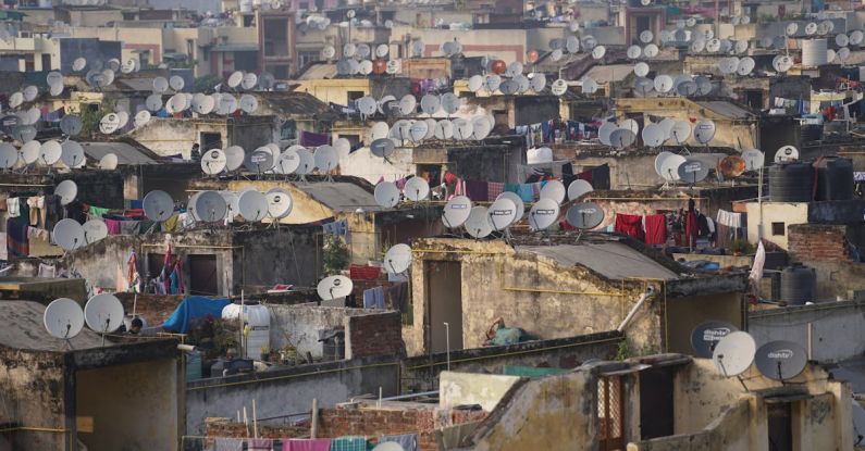 Overpopulation - Poor Building Rooftops with Satellite Antennas