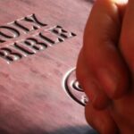 Cross-Cultural Education - Person Hands on Holy Bible