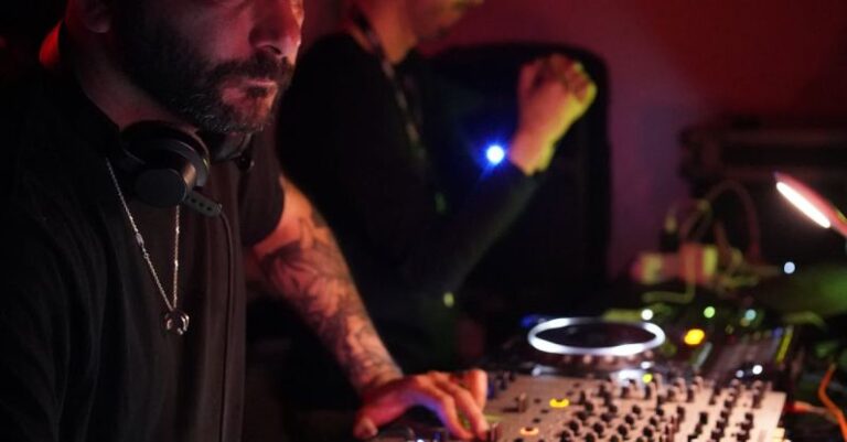 Genetic Editing - A man with a beard and tattoos playing music