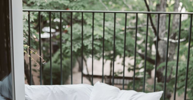 Travel Blogging - Laptop On Bed Near The Balcony